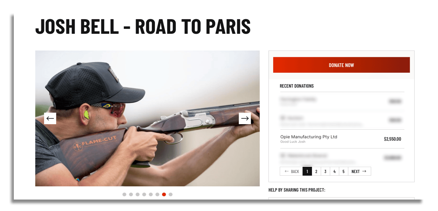 Josh Bell holding a rifle sponsored by OPIE Manufacturing Group during his preparation for the Paris Games 2024