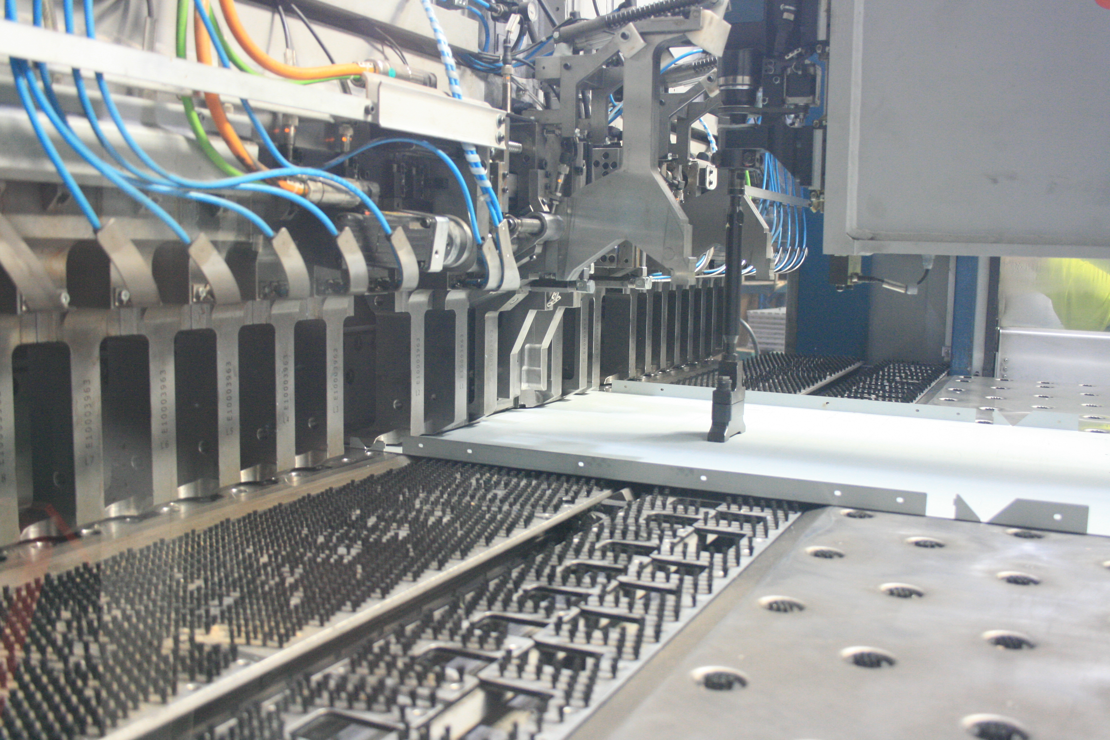 Wilson & Gilkes sheet metal fabrication machine handling precision metal components